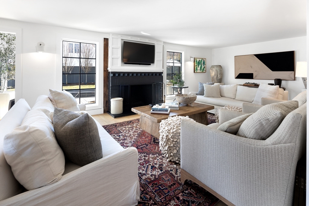 178 Otis Street Hingham, MA 02043 - Photo 18 of 41 a living room with furniture fireplace and flat screen tv