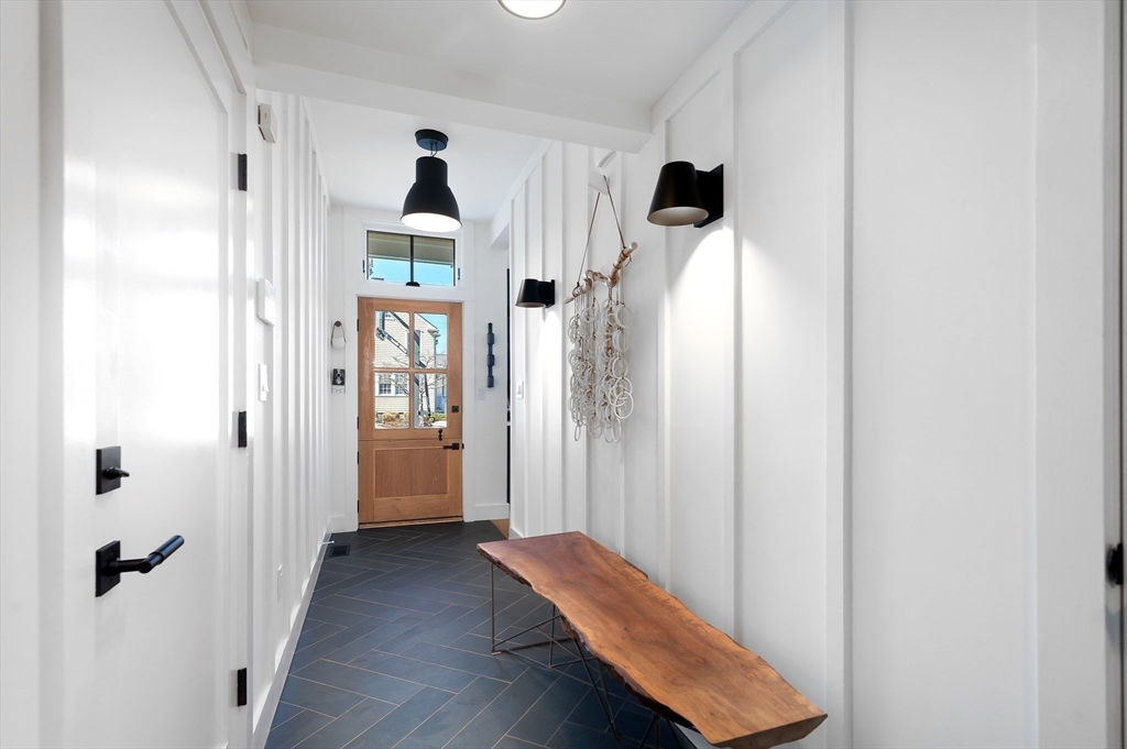 178 Otis Street Hingham, MA 02043 - Photo 20 of 41 a view of a hallway with front door