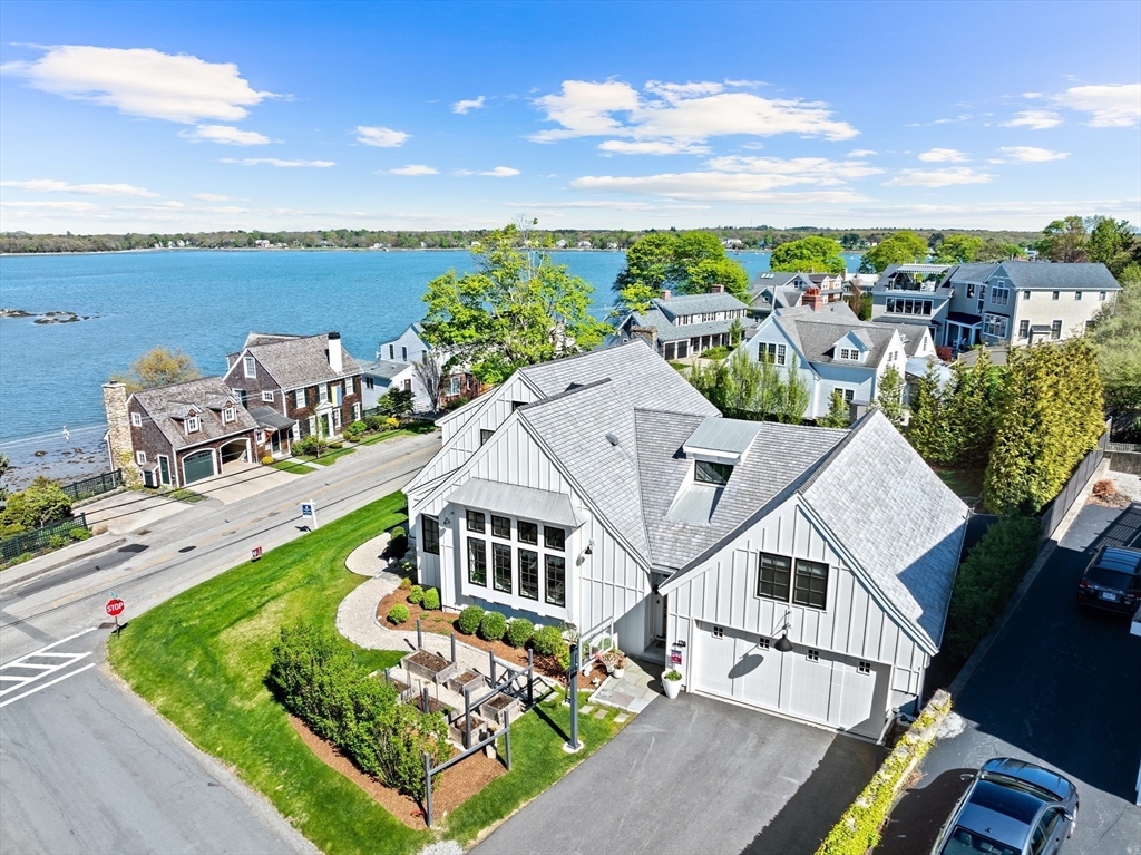 178 Otis Street Hingham, MA 02043 - Photo 2 of 41 a aerial view of a house with swimming pool and ocean view