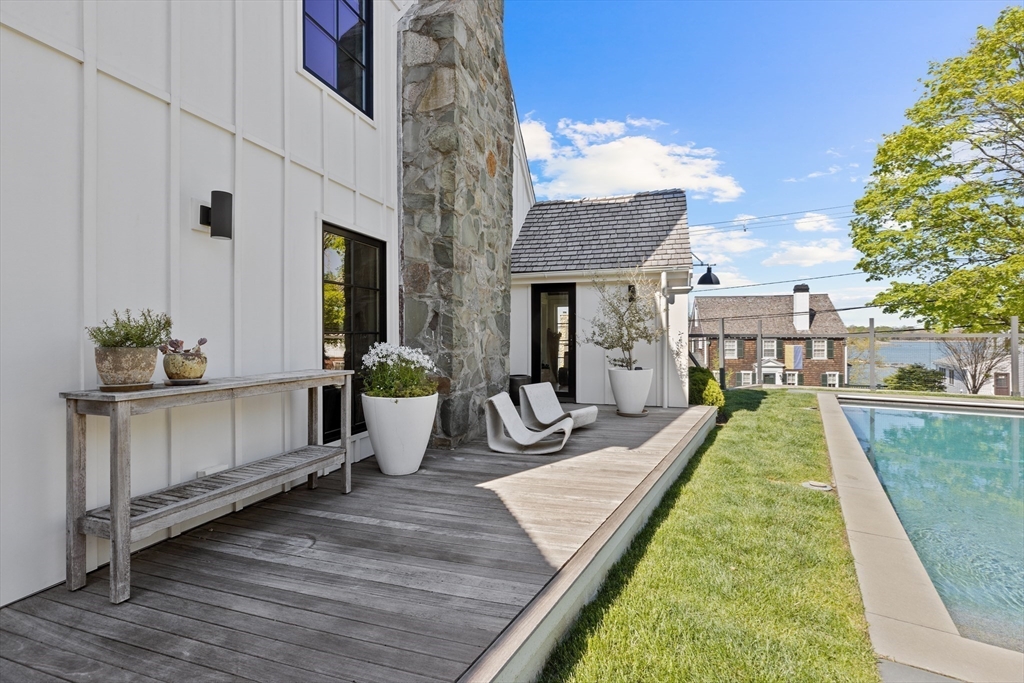 178 Otis Street Hingham, MA 02043 - Photo 39 of 41 a view of a swimming pool with potted plants
