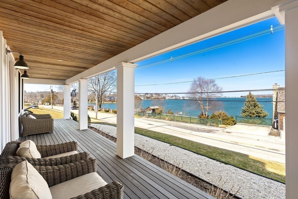 178 Otis Street Hingham, MA 02043 - Photo 4 of 41 a living room with furniture and a floor to ceiling window