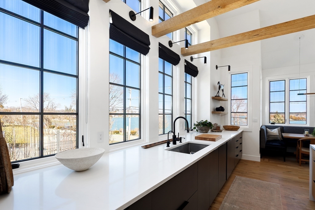 178 Otis Street Hingham, MA 02043 - Photo 7 of 41 a kitchen with a sink and living room