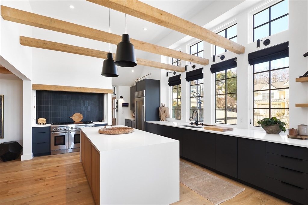 178 Otis Street Hingham, MA 02043 - Photo 10 of 41 a kitchen with stainless steel appliances kitchen island granite countertop a sink and cabinets