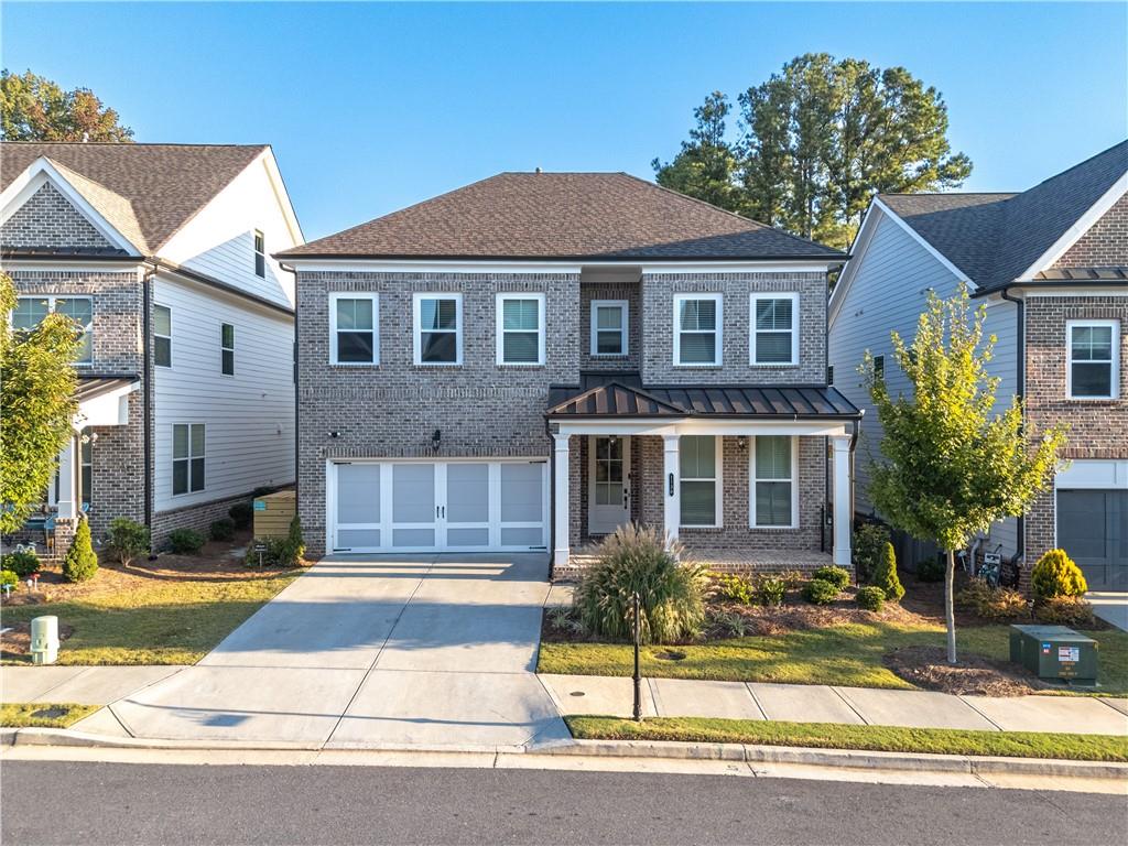 1130 Pennington View Lane Alpharetta, GA 30004 - Photo 1 of 1 a front view of a house with a yard