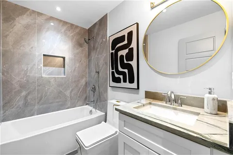 a bathroom with a sink and a bathtub