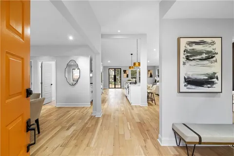 a view of a living room and wooden floor