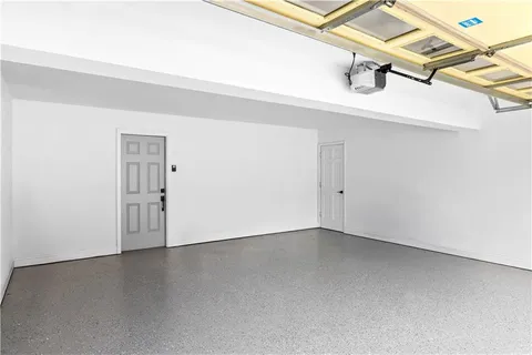 an empty room with a rug