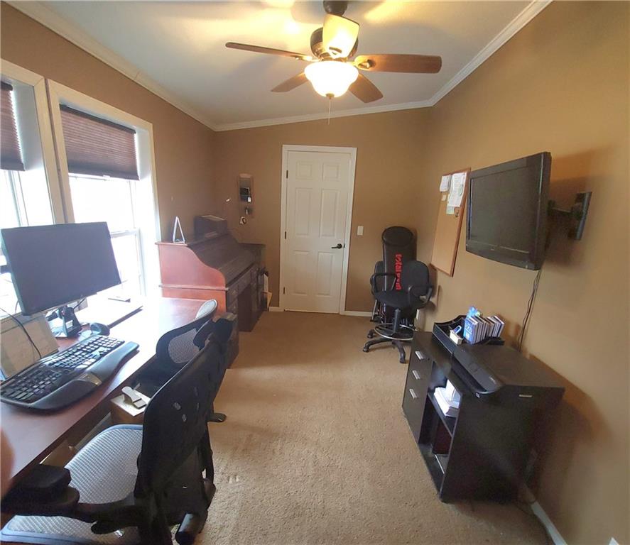 257 Hilltop Acres Road Slippery Rock, PA 16057 - Photo 12 of 25 a room with furniture a flat screen tv and a window