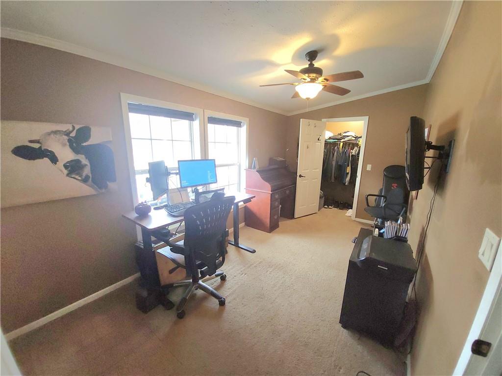 257 Hilltop Acres Road Slippery Rock, PA 16057 - Photo 13 of 25 a view of a workspace with furniture and a window