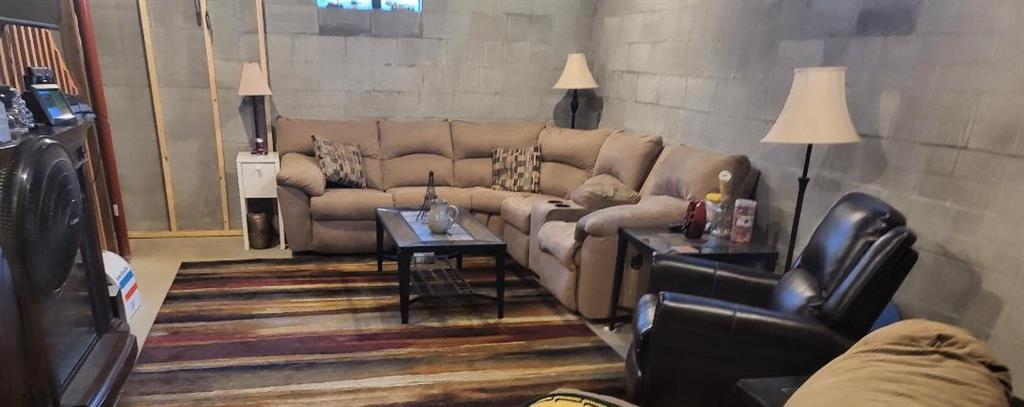 257 Hilltop Acres Road Slippery Rock, PA 16057 - Photo 18 of 25 a living room with furniture and a lamp