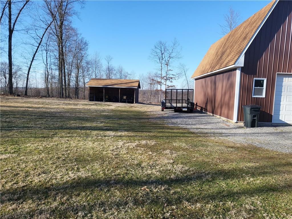 257 Hilltop Acres Road Slippery Rock, PA 16057 - Photo 22 of 25 a view of a house with a yard