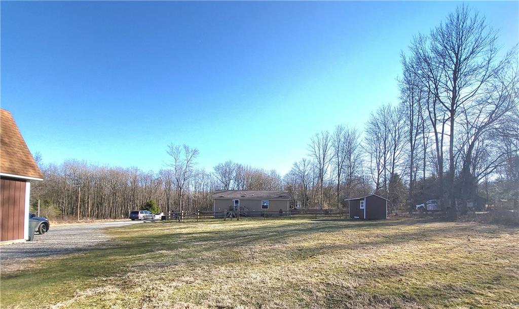 257 Hilltop Acres Road Slippery Rock, PA 16057 - Photo 23 of 25 a view of a yard with a house