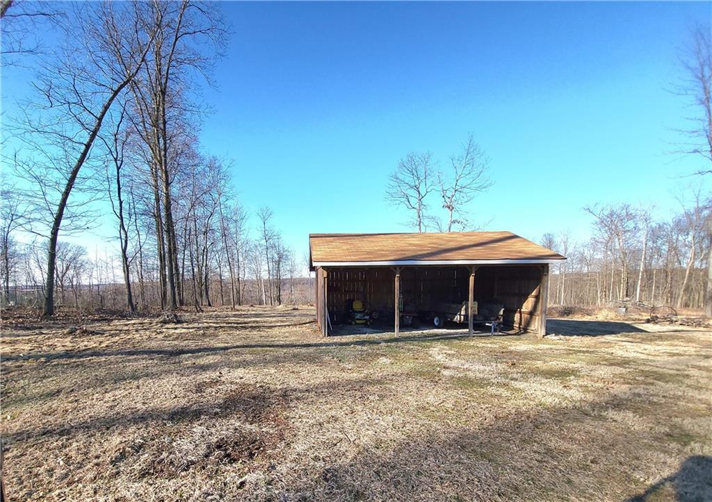 257 Hilltop Acres Road Slippery Rock, PA 16057 - Photo 24 of 25 a front view of a house with a yard