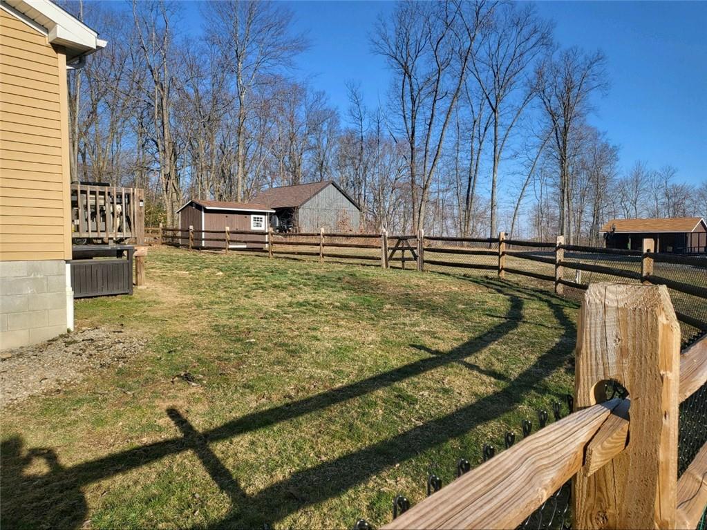 257 Hilltop Acres Road Slippery Rock, PA 16057 - Photo 3 of 25 a view of a swimming pool with a patio