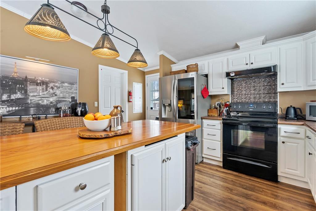 257 Hilltop Acres Road Slippery Rock, PA 16057 - Photo 6 of 25 a kitchen with stainless steel appliances granite countertop a sink and cabinets