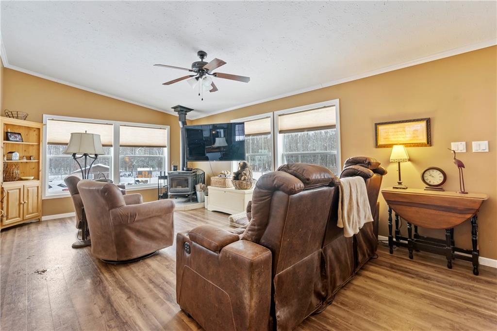 257 Hilltop Acres Road Slippery Rock, PA 16057 - Photo 7 of 25 a living room with furniture a table and wooden floor