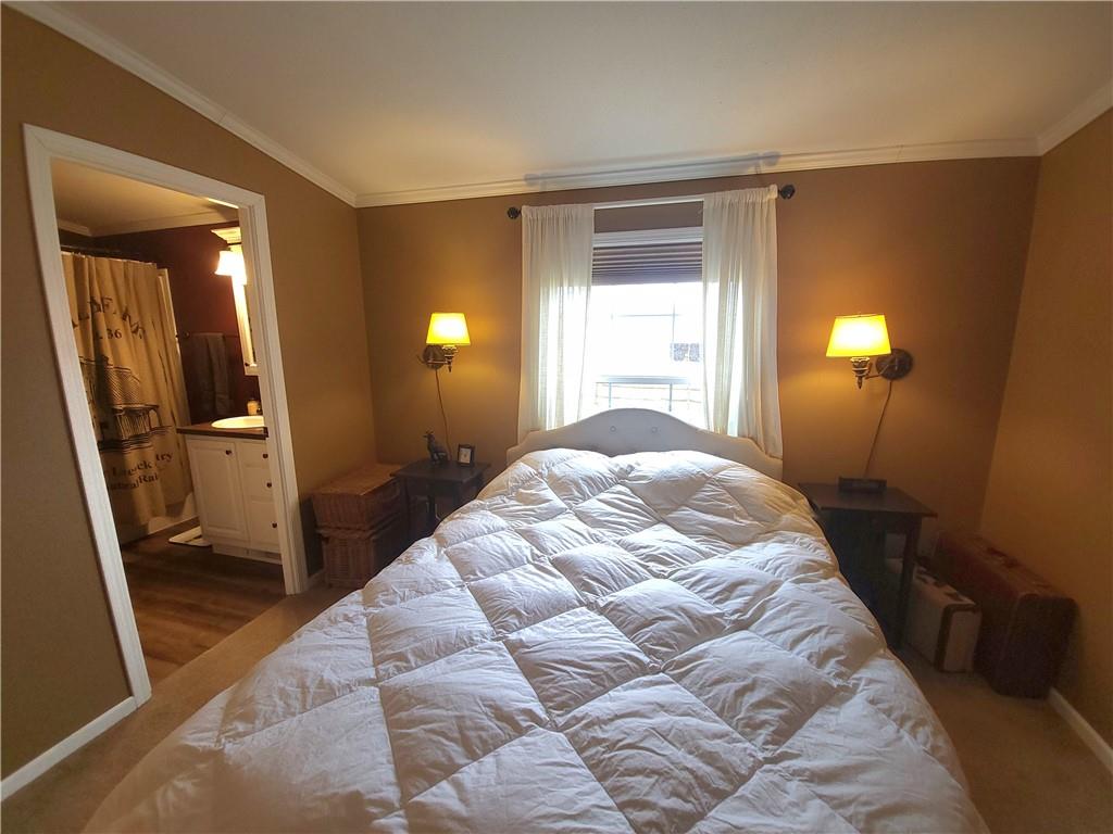 257 Hilltop Acres Road Slippery Rock, PA 16057 - Photo 8 of 25 a bedroom with a bed and a mirror