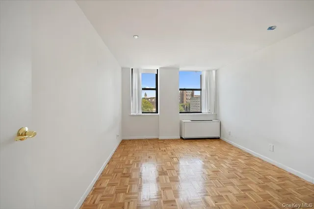 a view of an empty room with a window