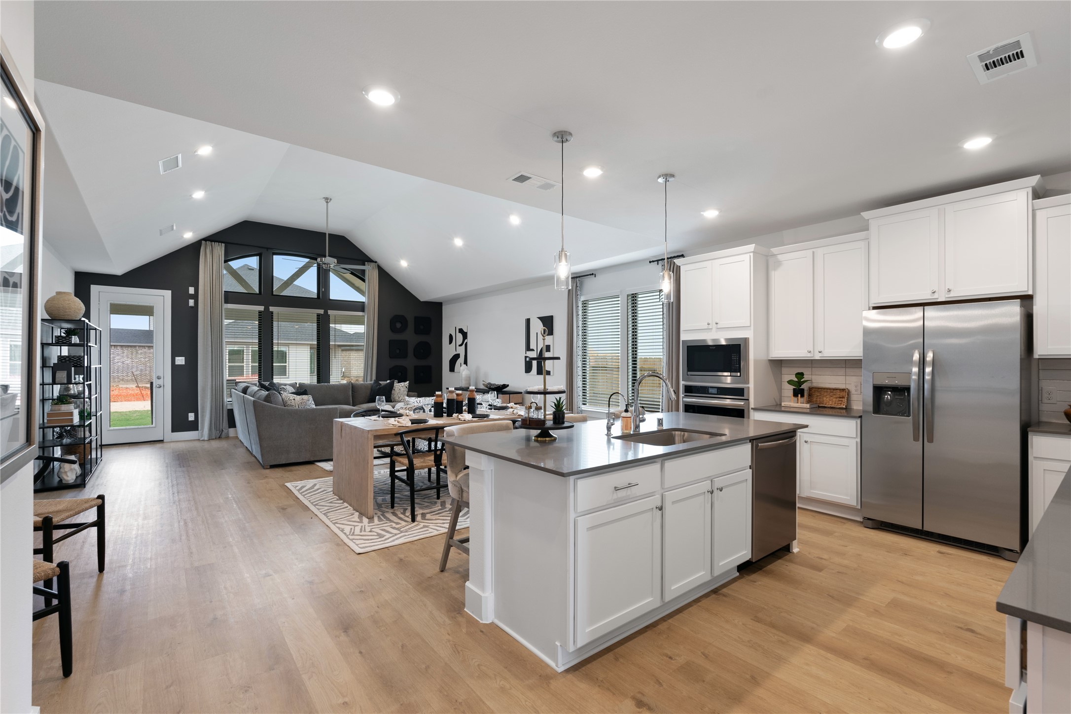 813 Green Ash Way Hempstead, TX 77445 - Photo 12 of 41 a kitchen with stainless steel appliances kitchen island granite countertop a stove and a refrigerator