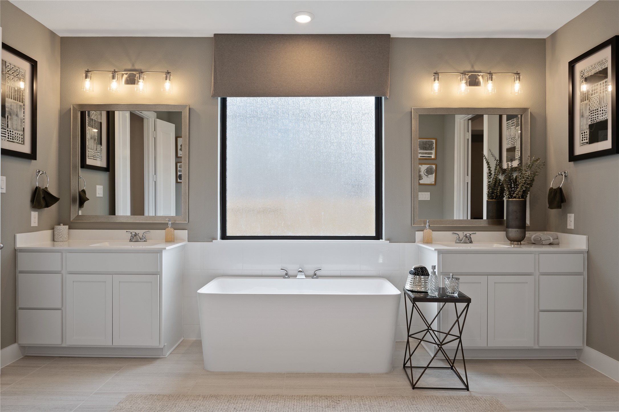 813 Green Ash Way Hempstead, TX 77445 - Photo 22 of 41 a bathroom with a bathtub a double vanity sink and a mirror