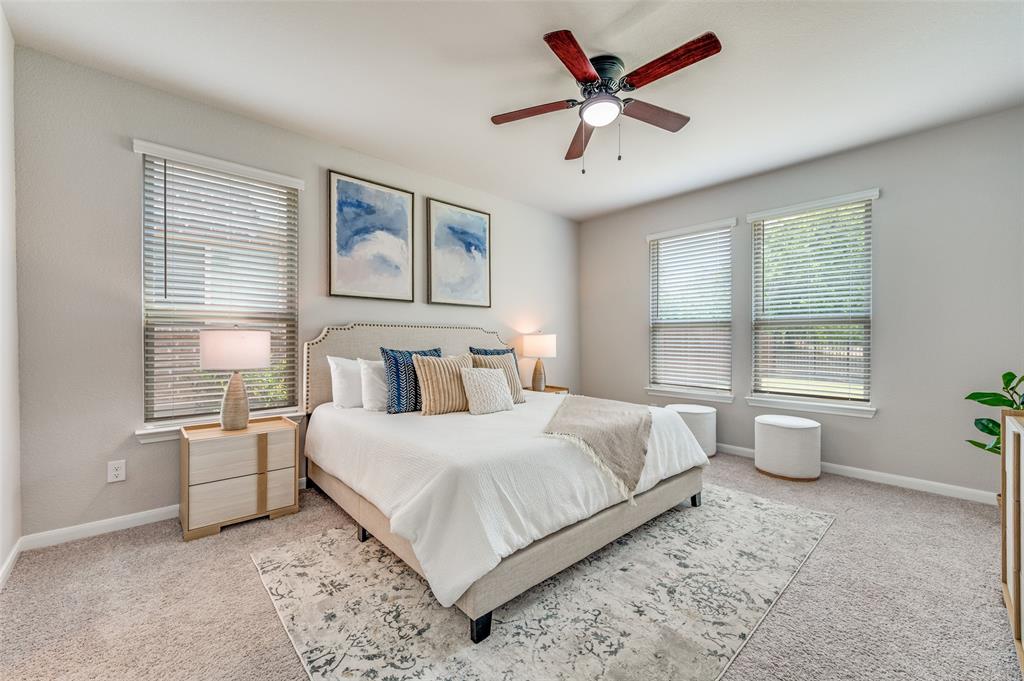 1240 Morning Ridge Trail Aubrey, TX 76227 - Photo 11 of 25 Carpeted bedroom with baseboards and a ceiling fan