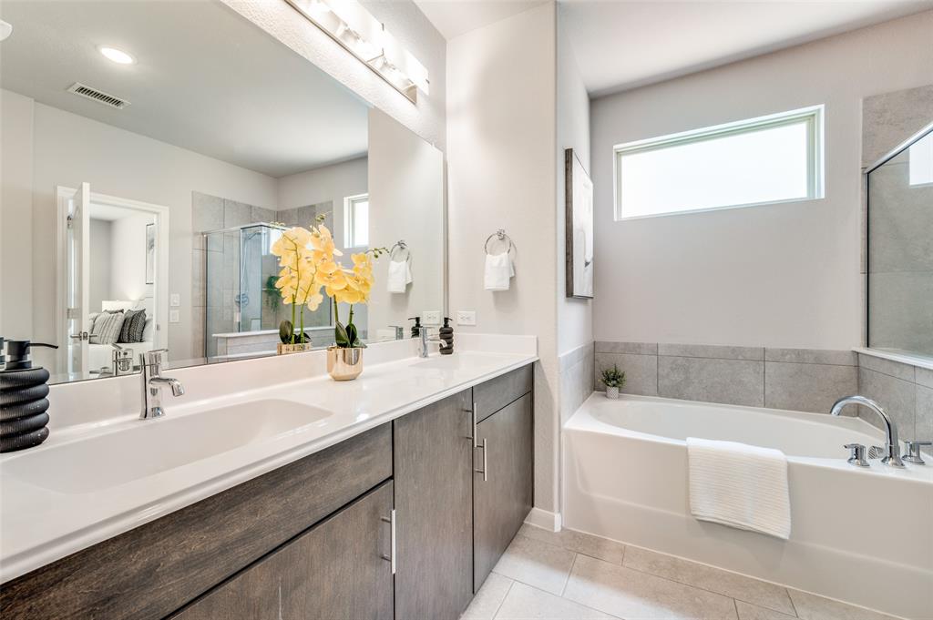 1240 Morning Ridge Trail Aubrey, TX 76227 - Photo 12 of 25 Full bath with light tile patterned floors, a stall shower, double vanity, and a bath