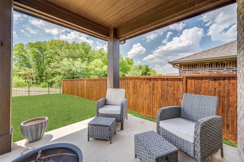 1240 Morning Ridge Trail Aubrey, TX 76227 - Photo 20 of 25 Fenced backyard with a patio area