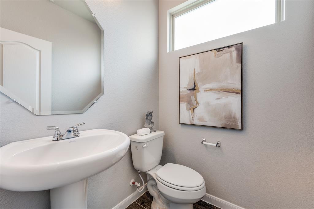 1240 Morning Ridge Trail Aubrey, TX 76227 - Photo 4 of 25 Half bath featuring a textured wall and toilet