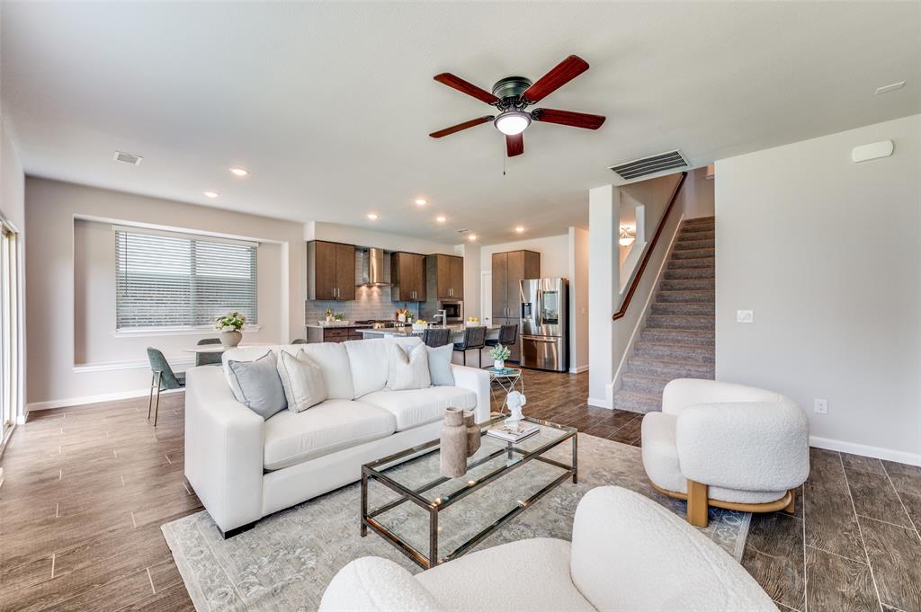 1240 Morning Ridge Trail Aubrey, TX 76227 - Photo 6 of 25 Living area with stairs, recessed lighting, ceiling fan, and wood finished floors