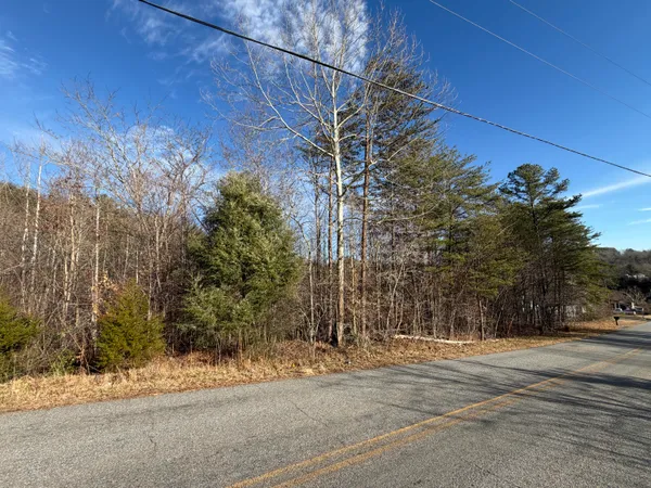 a view of a road with a building in the background