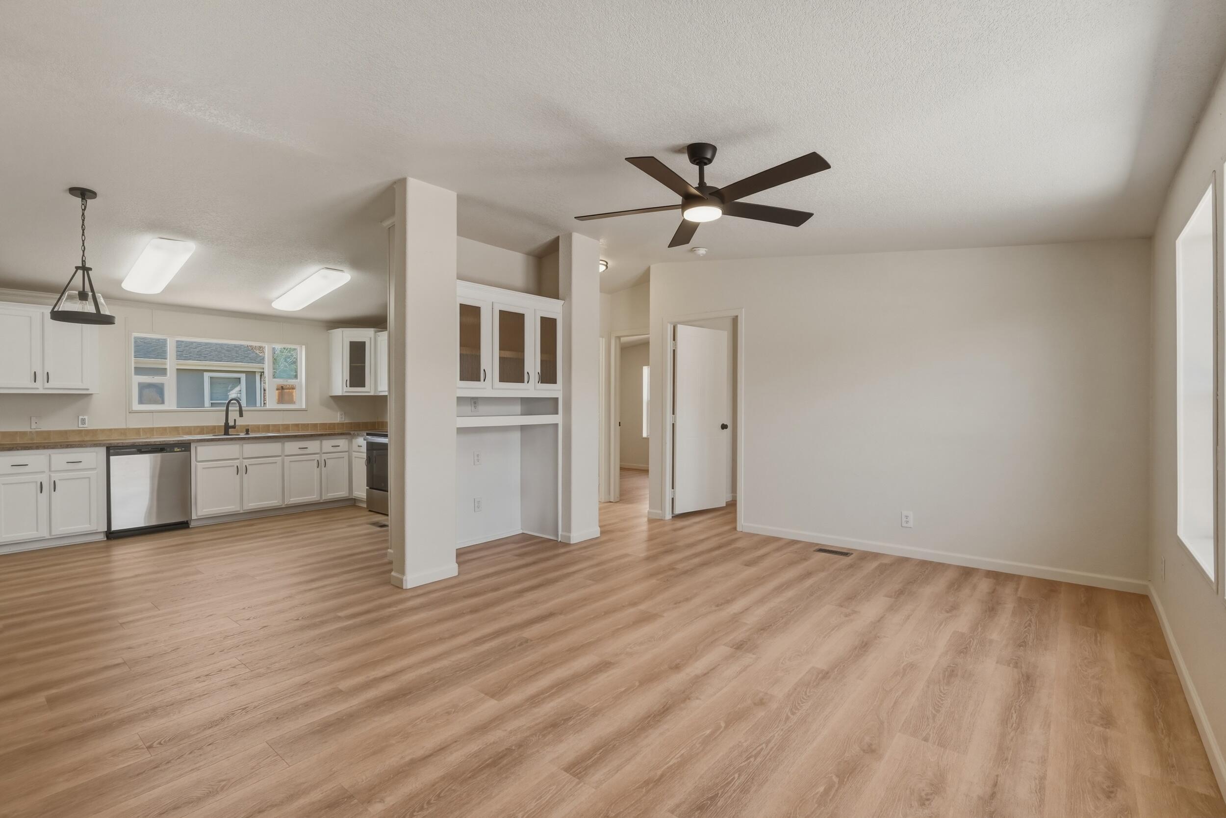 312 East Cedar Milll Road Star Valley, AZ 85541 - Photo 11 of 27 a view of a big room with wooden floor and a kitchen