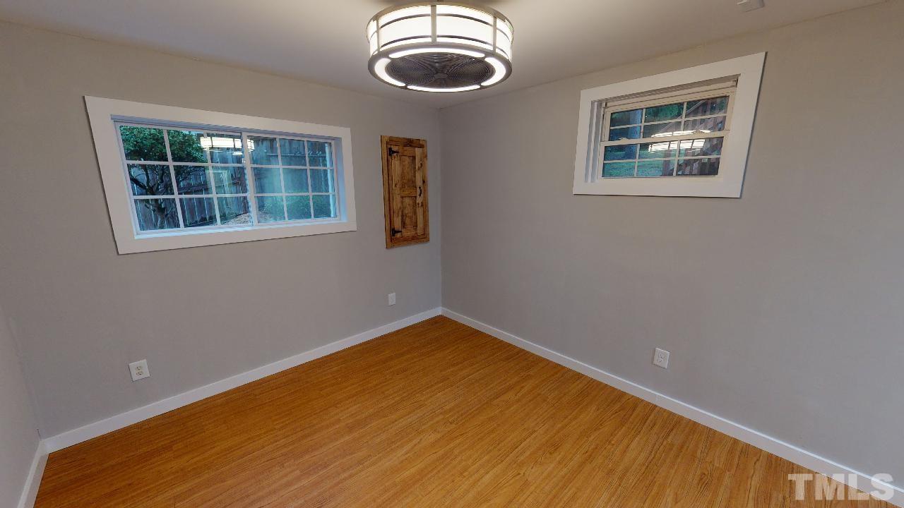 1504 North King Charles Road Raleigh, NC 27610 - Photo 20 of 28 Located on the Lower Level with Barn Style Door to the Long Reach In Closet and a Wonderful Bath!