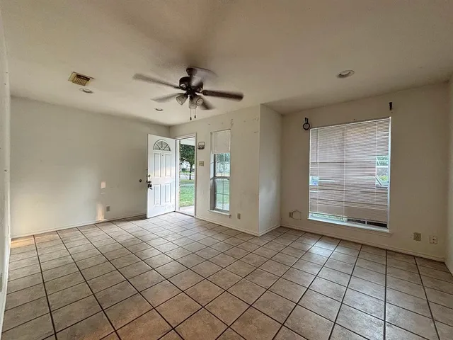 a view of an empty room and window