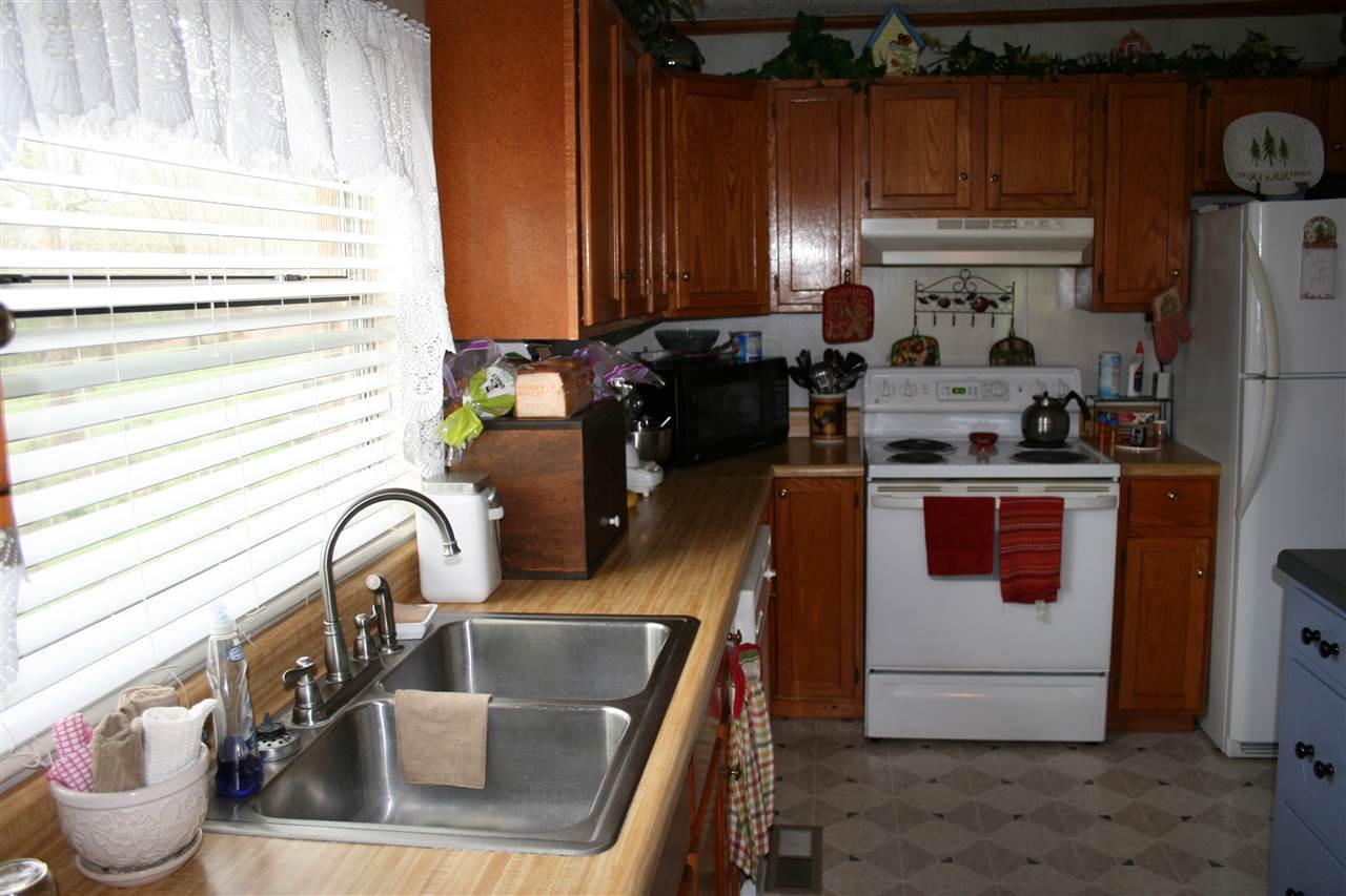 1502 Ladd Springs Road Southeast Cleveland, TN 37323 - Photo 13 of 19 a kitchen with a refrigerator and a sink