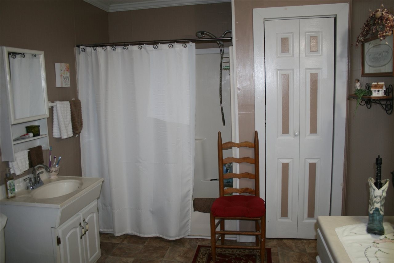 1502 Ladd Springs Road Southeast Cleveland, TN 37323 - Photo 15 of 19 a bathroom with a sink toilet and shower