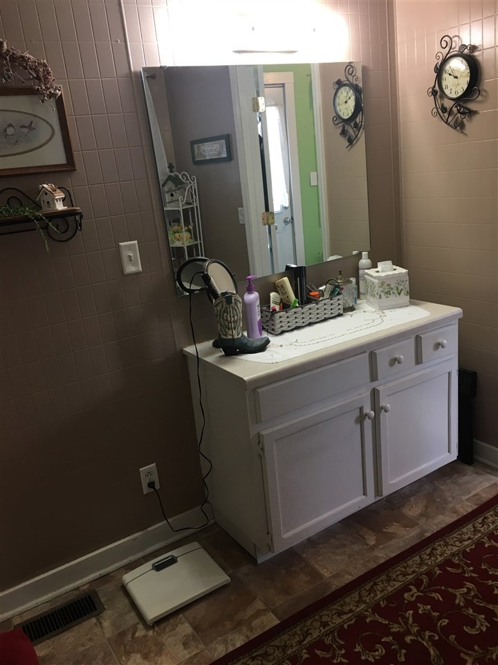 1502 Ladd Springs Road Southeast Cleveland, TN 37323 - Photo 16 of 19 a bathroom with a sink and a mirror