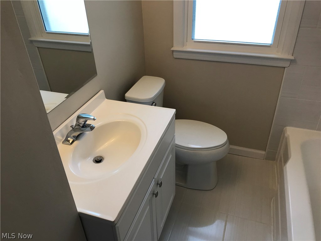 5814 Snow Road Cleveland, OH 44129 - Photo 2 of 8 Main bathroom has new vanity and new ceramic tiles.