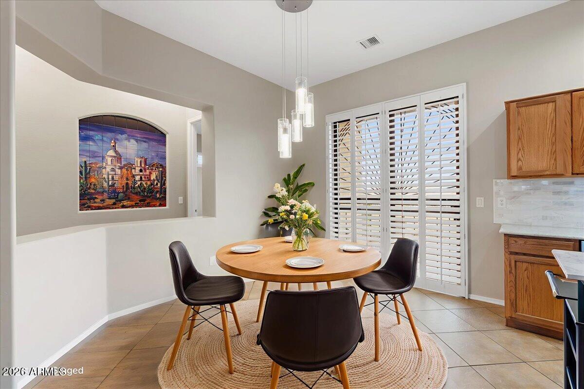 892 West Deep Gorge Road Camp Verde, AZ 86322 - Photo 11 of 38 a view of a dining room with furniture and a potted plant