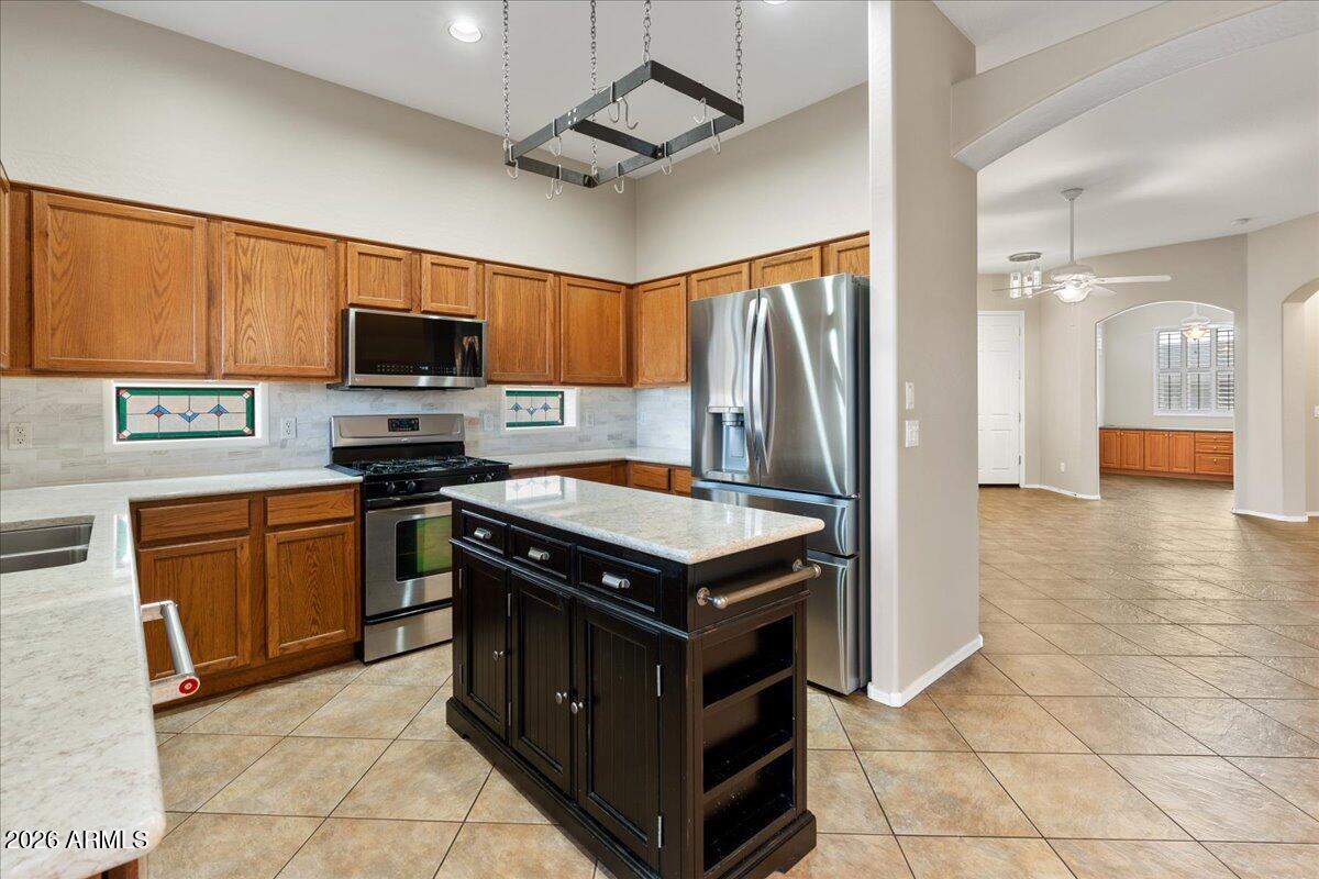 892 West Deep Gorge Road Camp Verde, AZ 86322 - Photo 13 of 38 a kitchen with stainless steel appliances granite countertop a stove a refrigerator and a sink