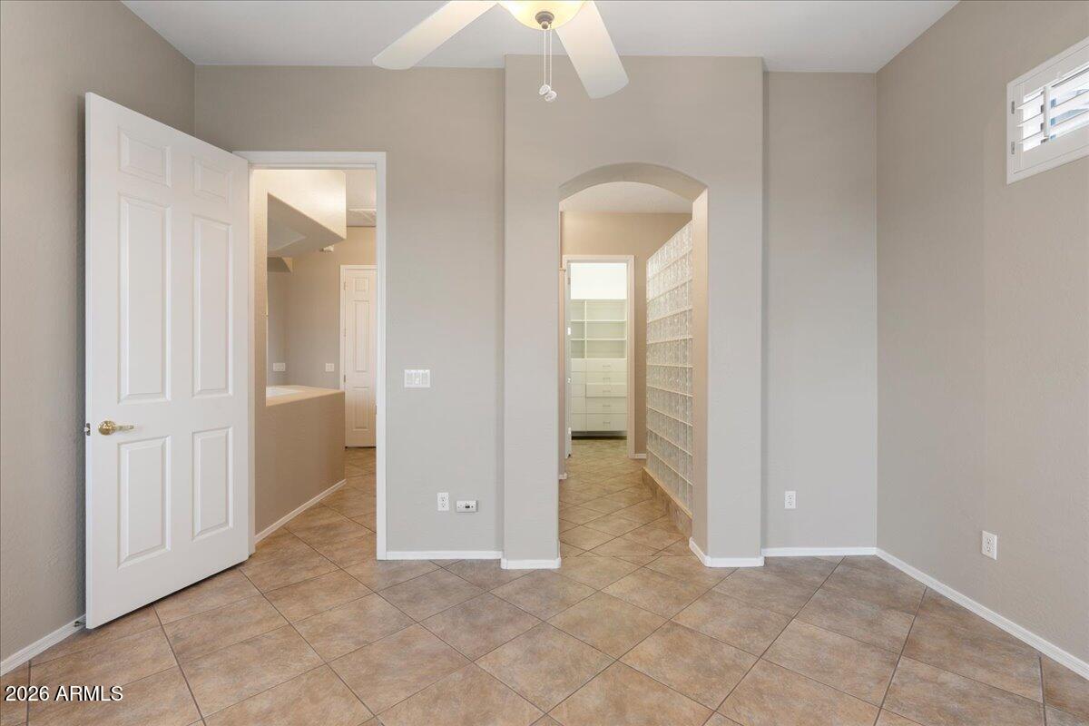 892 West Deep Gorge Road Camp Verde, AZ 86322 - Photo 20 of 38 wooden floor with a chandelier fan and windows