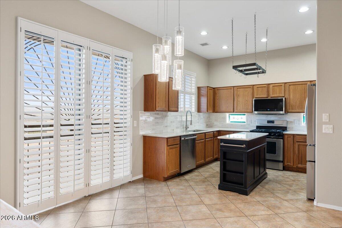 892 West Deep Gorge Road Camp Verde, AZ 86322 - Photo 9 of 38 a kitchen with stainless steel appliances granite countertop a stove top oven a sink dishwasher and a refrigerator