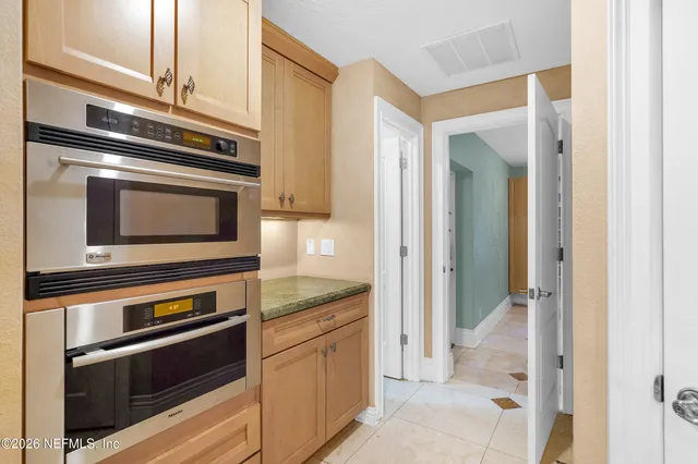 a bathroom with a tub and shower