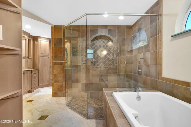 a bathroom with a sink a toilet and a window