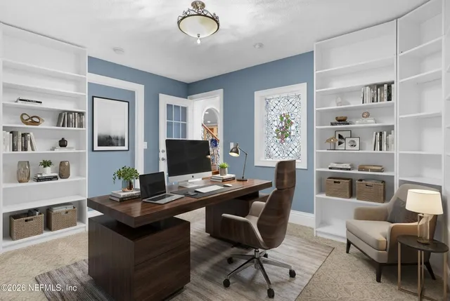 a bedroom with a large bed and a couch