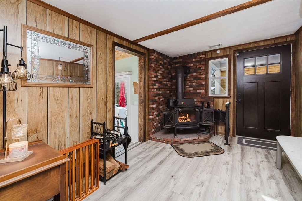 185 Moulton Street Rehoboth, MA 02769 - Photo 14 of 40 a view of a hallway with wooden floor and staircase
