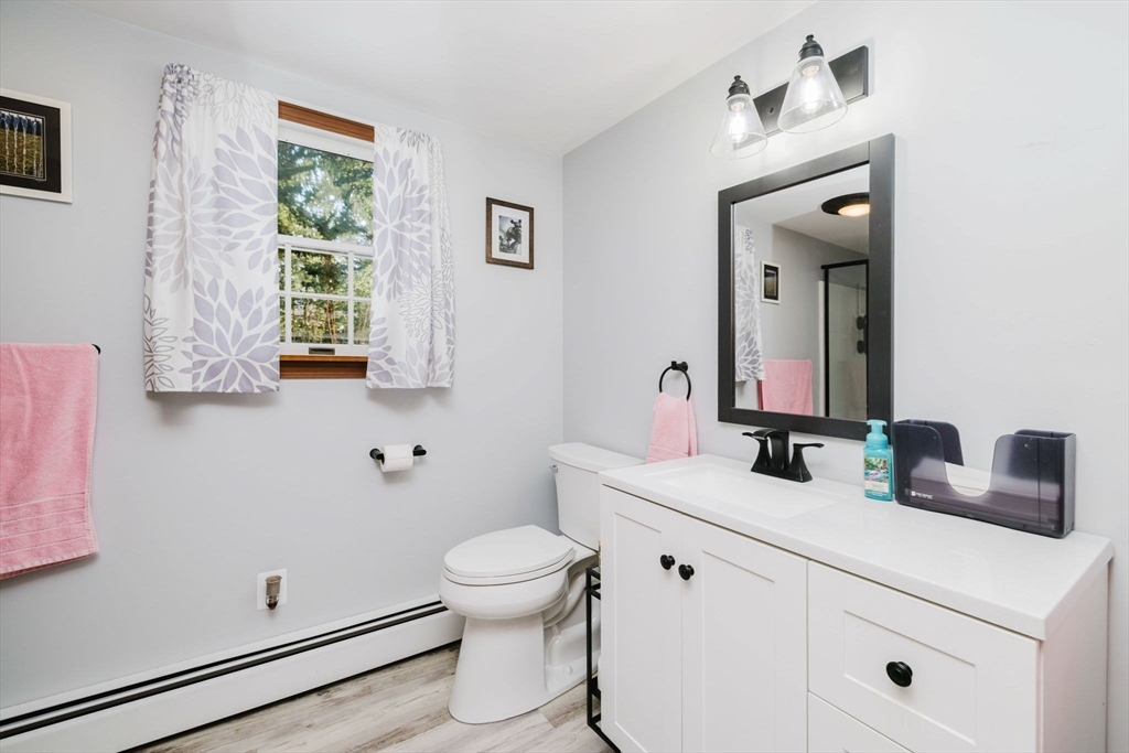 185 Moulton Street Rehoboth, MA 02769 - Photo 16 of 40 a bathroom with a sink toilet and mirror