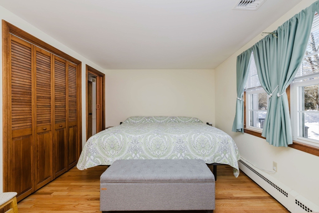 185 Moulton Street Rehoboth, MA 02769 - Photo 19 of 40 a room with a bed and wooden floor