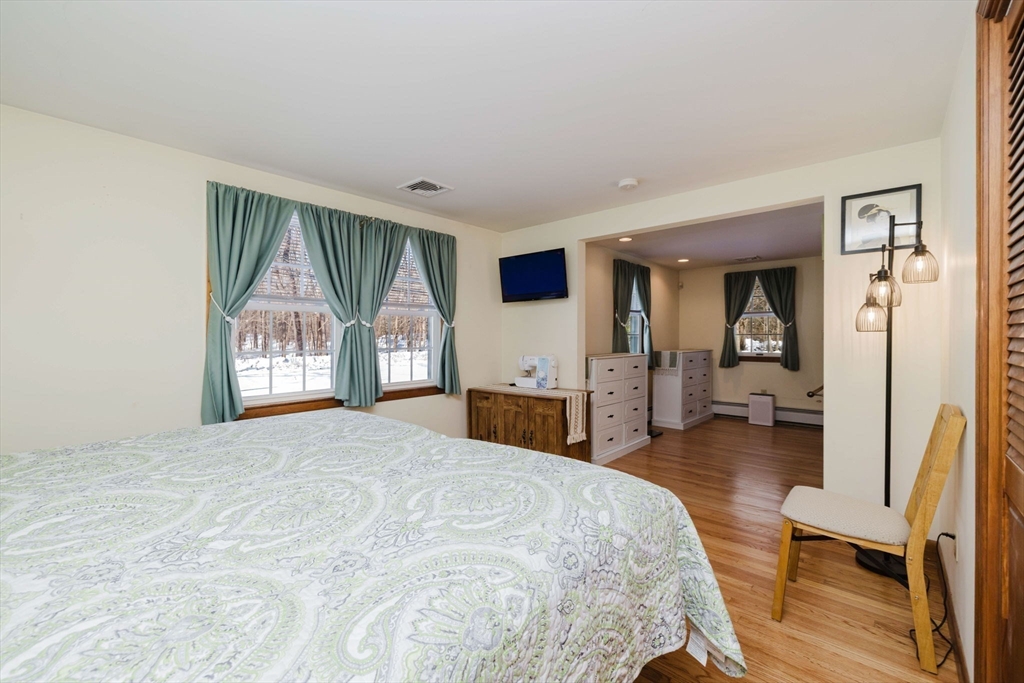 185 Moulton Street Rehoboth, MA 02769 - Photo 21 of 40 a spacious bedroom with a large bed and a large window