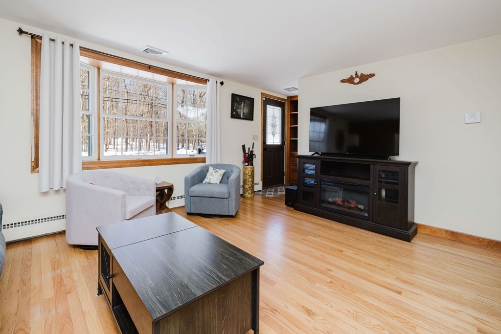 185 Moulton Street Rehoboth, MA 02769 - Photo 26 of 40 a living room with furniture and a flat screen tv