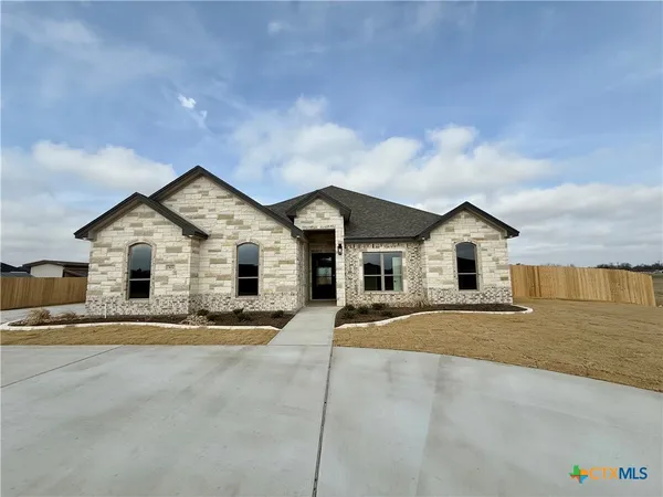 a view of house with yard and entertaining space